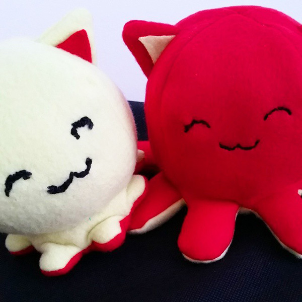 The first Taneko the Octo-puss prototype plush toy was light green and red