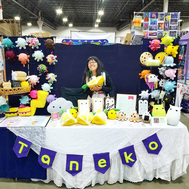 Taneko Says Hello table booth display at Motor City Comic Con