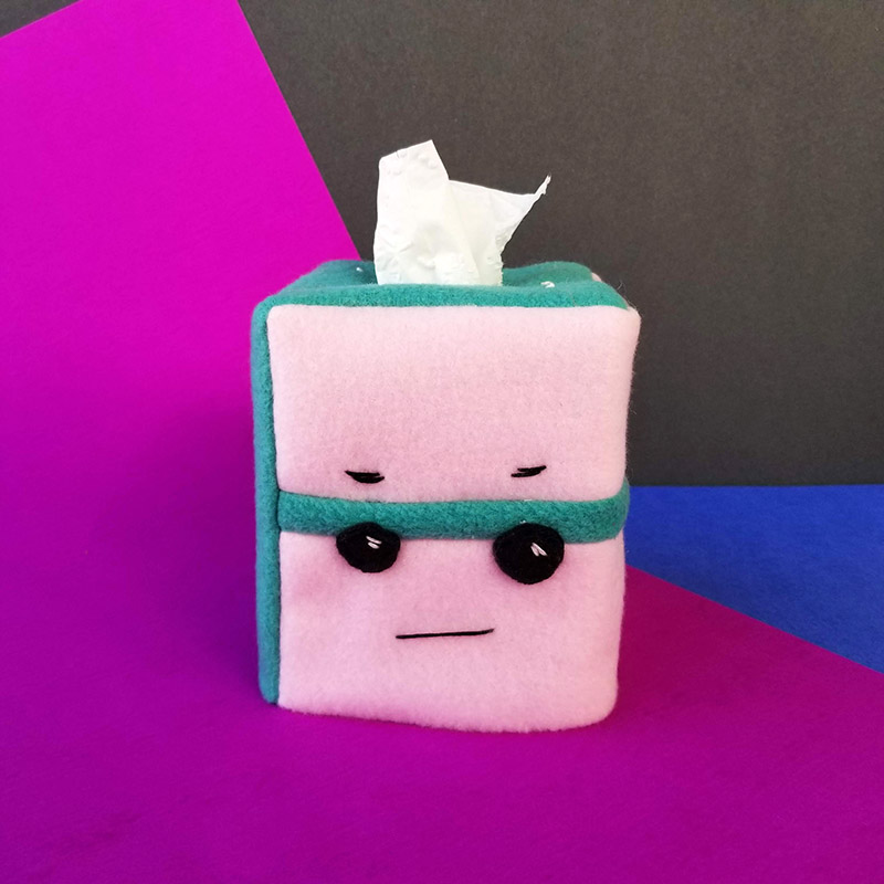 tissue box Cake Cozy with a grimacing face
