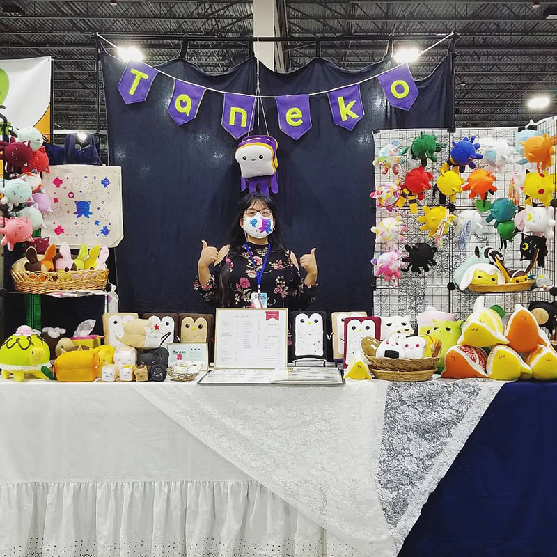 Taneko Says Hello table booth display at Motor City Comic Con