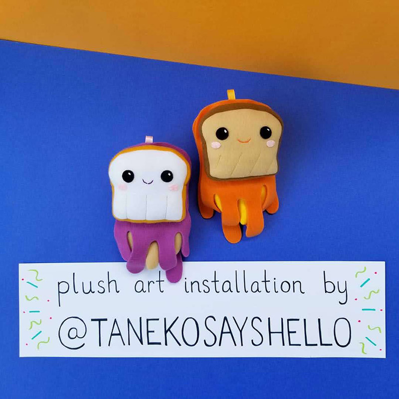 signage for Taneko Says Hello plush art installation