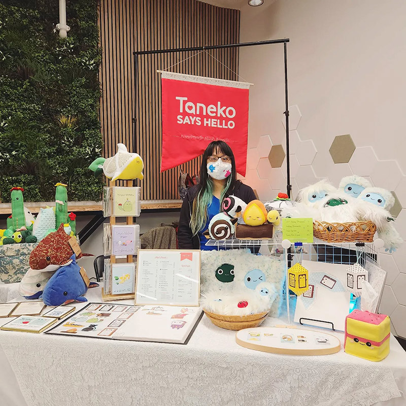 Taneko Says Hello table booth display at Midnight Madness