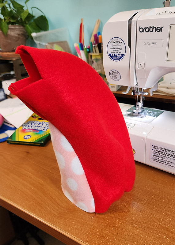 red and pink prototype of a plush toy in progress