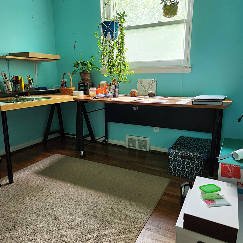 taking apart sewing studio with blue walls