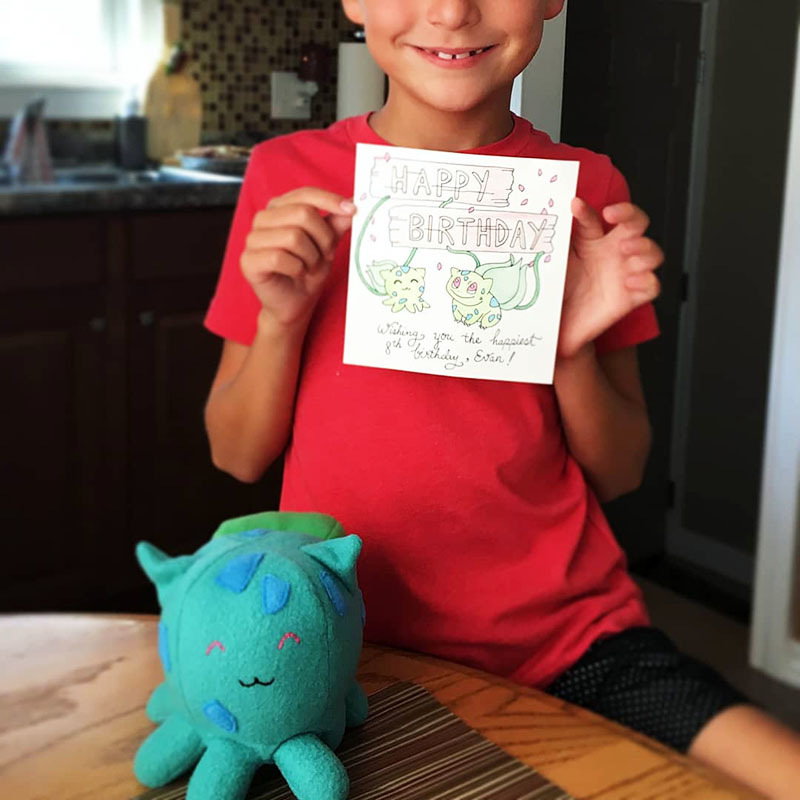 Bulbasaur cosplay Taneko and birthday card with a smiling kid